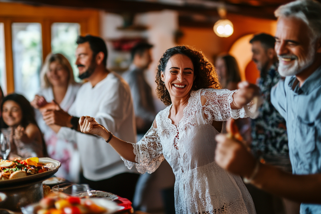 A diverse group of people from Spain, enjoying a vibrant gathering with food and dancing outdoors.